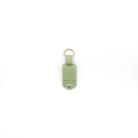 Groene sleutelhanger met initialen en fotohoudertje